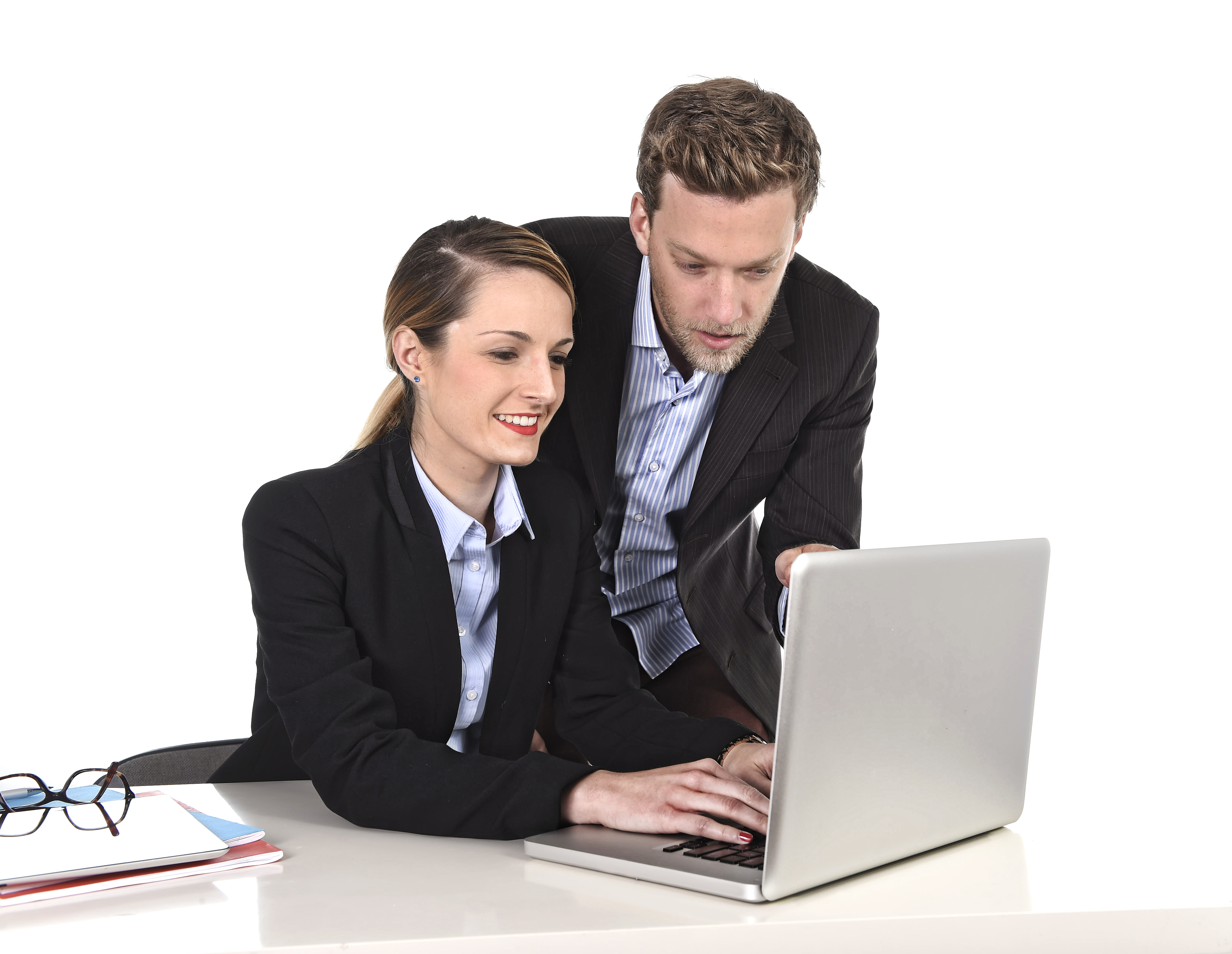 Image of a business woman showing something to a colleague on a computer - Represents that Your town planner can teach you the basics about development approval