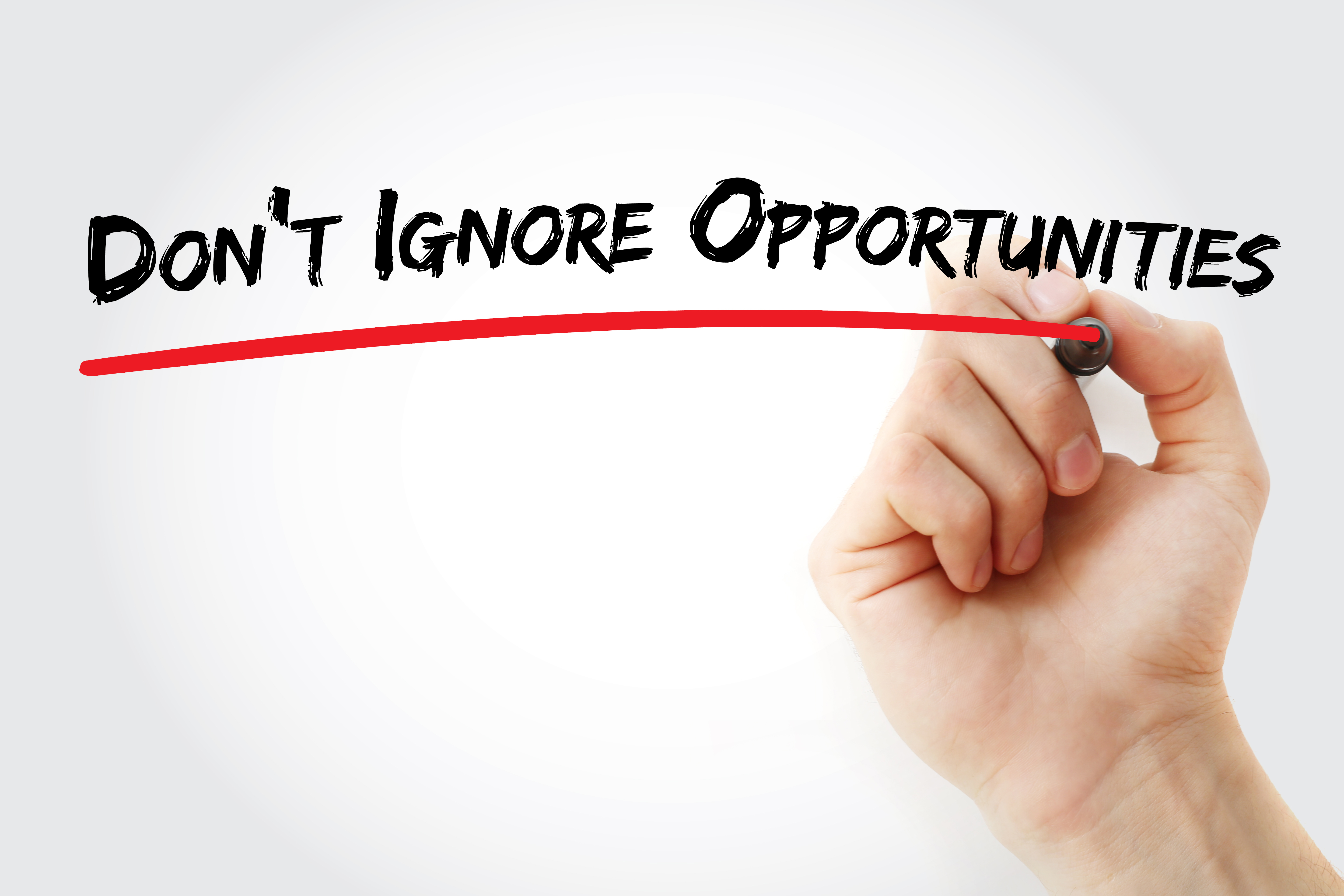 image of someone writing Don't Ignore Opportunities. Shows that taking advantage of opportunities is a well known Property Investing Secret